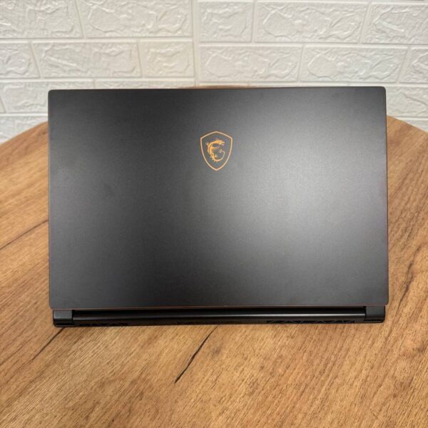 Ігровий ноутбук Б-клас MSI GS65 8RF Stealth Thin / 15.6" (1920x1080) IPS / Intel Core i7-8750H (6 (12) ядра по 2.2 - 4.1 GHz) / 32 GB DDR4 / 512 GB SSD / nVidia GeForce GTX 1070 Max-Q, 8 GB GDDR5, 256-bit / WebCam - Зображення 3