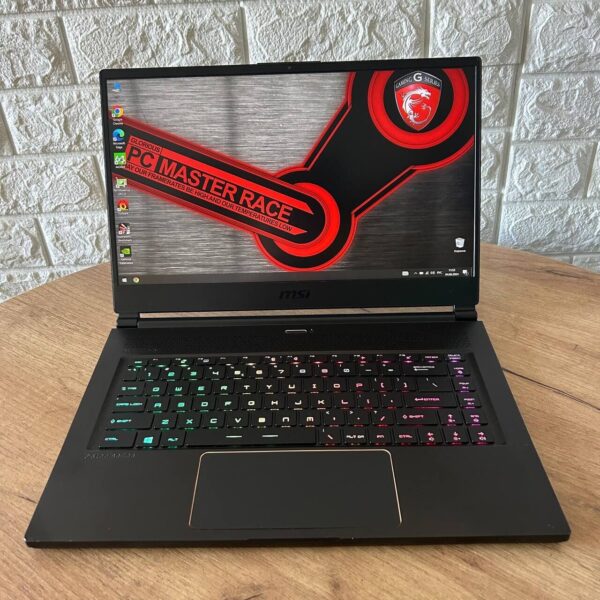 Ігровий ноутбук Б-клас MSI GS65 Stealth 8SF / 15.6" (1920x1080) IPS / Intel Core i7-8750H (6 (12) ядра по 2.2 - 4.1 GHz) / 32 GB DDR4 / 512 GB SSD / nVidia GeForce RTX 2060, 6 GB GDDR6, 192-bit / WebCam - Зображення 2