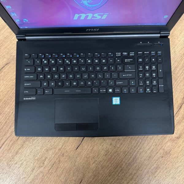 Ігровий ноутбук Б-клас MSI GL62M 7REX / 15.6" (1920x1080) TN / Intel Core i7-7700HQ (4 (8) ядра по 2.8 - 3.8 GHz) / 16 GB DDR4 / 256 GB SSD M.2 + 1000 GB HDD / nVidia GeForce GTX 1050 Ti, 4 GB GDDR5, 128-bit / WebCam - Зображення 7