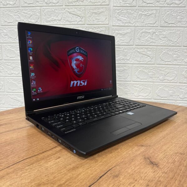 Ігровий ноутбук Б-клас MSI GL62M 7REX / 15.6" (1920x1080) TN / Intel Core i7-7700HQ (4 (8) ядра по 2.8 - 3.8 GHz) / 16 GB DDR4 / 256 GB SSD M.2 + 1000 GB HDD / nVidia GeForce GTX 1050 Ti, 4 GB GDDR5, 128-bit / WebCam - Зображення 4