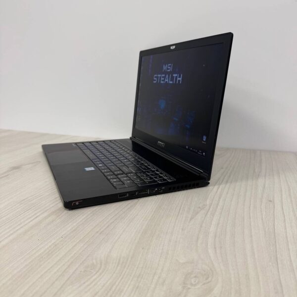 Ігровий ноутбук Б-клас MSI GS63VR 7RF Stealth Pro / 15.6" (1920x1080) TN / Intel Core i7-7700HQ (4 (8) ядра по 2.8 - 3.8 GHz) / 16 GB DDR4 / 256 GB SSD M.2 / nVidia GeForce GTX 1060, 6 GB GDDR5, 192-bit / WebCam - Зображення 5