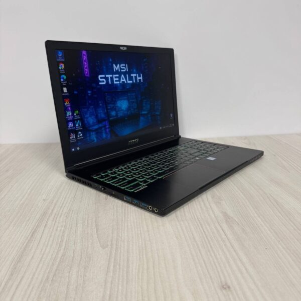Ігровий ноутбук Б-клас MSI GS63VR 7RF Stealth Pro / 15.6" (1920x1080) TN / Intel Core i7-7700HQ (4 (8) ядра по 2.8 - 3.8 GHz) / 16 GB DDR4 / 256 GB SSD M.2 / nVidia GeForce GTX 1060, 6 GB GDDR5, 192-bit / WebCam - Зображення 4