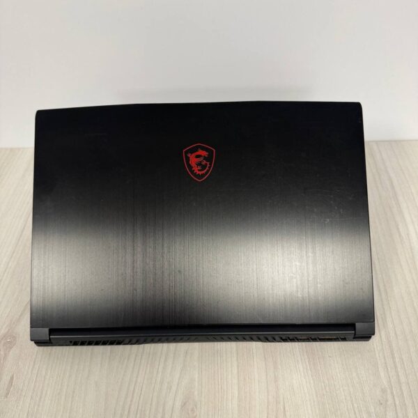 Ігровий ноутбук Б-клас MSI GF65 Thin 10SDR / 15.6" (1920x1080) IPS / Intel Core i7-10750H (6 (12) ядер по 2.6 - 5.0 GHz) / 8 GB DDR4 / 512 GB SSD NVMe / nVidia GeForce GTX 1660 Ti, 6 GB GDDR6, 192-bit / WebCam - Зображення 3