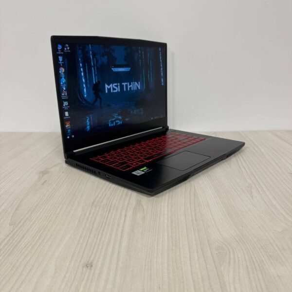 Ігровий ноутбук Б-клас MSI GF65 Thin 10SDR / 15.6" (1920x1080) IPS / Intel Core i7-10750H (6 (12) ядер по 2.6 - 5.0 GHz) / 8 GB DDR4 / 512 GB SSD NVMe / nVidia GeForce GTX 1660 Ti, 6 GB GDDR6, 192-bit / WebCam - Зображення 4