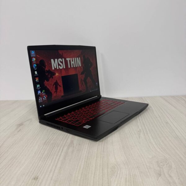 Ігровий ноутбук Б-клас MSI GF65 Thin 10SER / 15.6" (1920x1080) IPS / Intel Core i7-10750H (6 (12) ядер по 2.6 - 5.0 GHz) / 16 GB DDR4 / 512 GB SSD NVMe / nVidia GeForce RTX 2060, 6 GB GDDR6, 192-bit / WebCam - Зображення 4