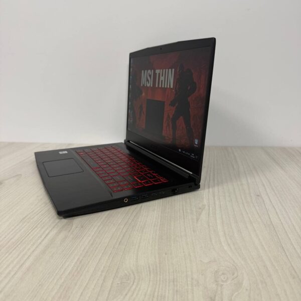 Ігровий ноутбук Б-клас MSI GF65 Thin 10SER / 15.6" (1920x1080) IPS / Intel Core i7-10750H (6 (12) ядер по 2.6 - 5.0 GHz) / 16 GB DDR4 / 512 GB SSD NVMe / nVidia GeForce RTX 2060, 6 GB GDDR6, 192-bit / WebCam - Зображення 5
